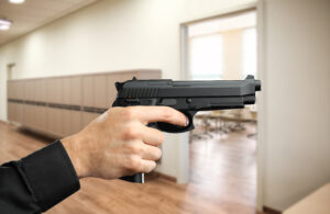Hand holding a gun- Atlanta Liquor Store Shooting Victim Lawyer